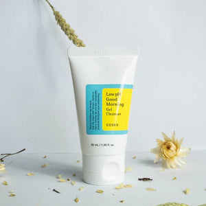 COSRX Low pH Good Morning Gel Cleanser tube with flowers and leaves on white background